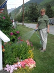 Judy Mallory watering the garden